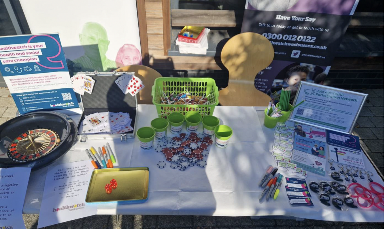 Photo of table at the Freshers Fair with different inertactive activities 