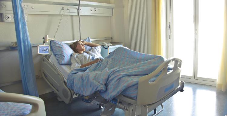 Person lying a hospital bed