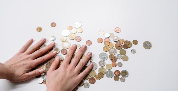 Image of hands counting coins