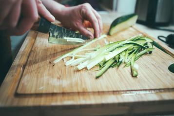 Cutting courgette on a chopping board