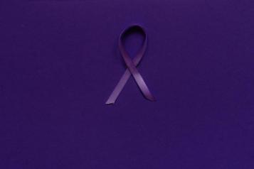 Purple ribbon on a purple background