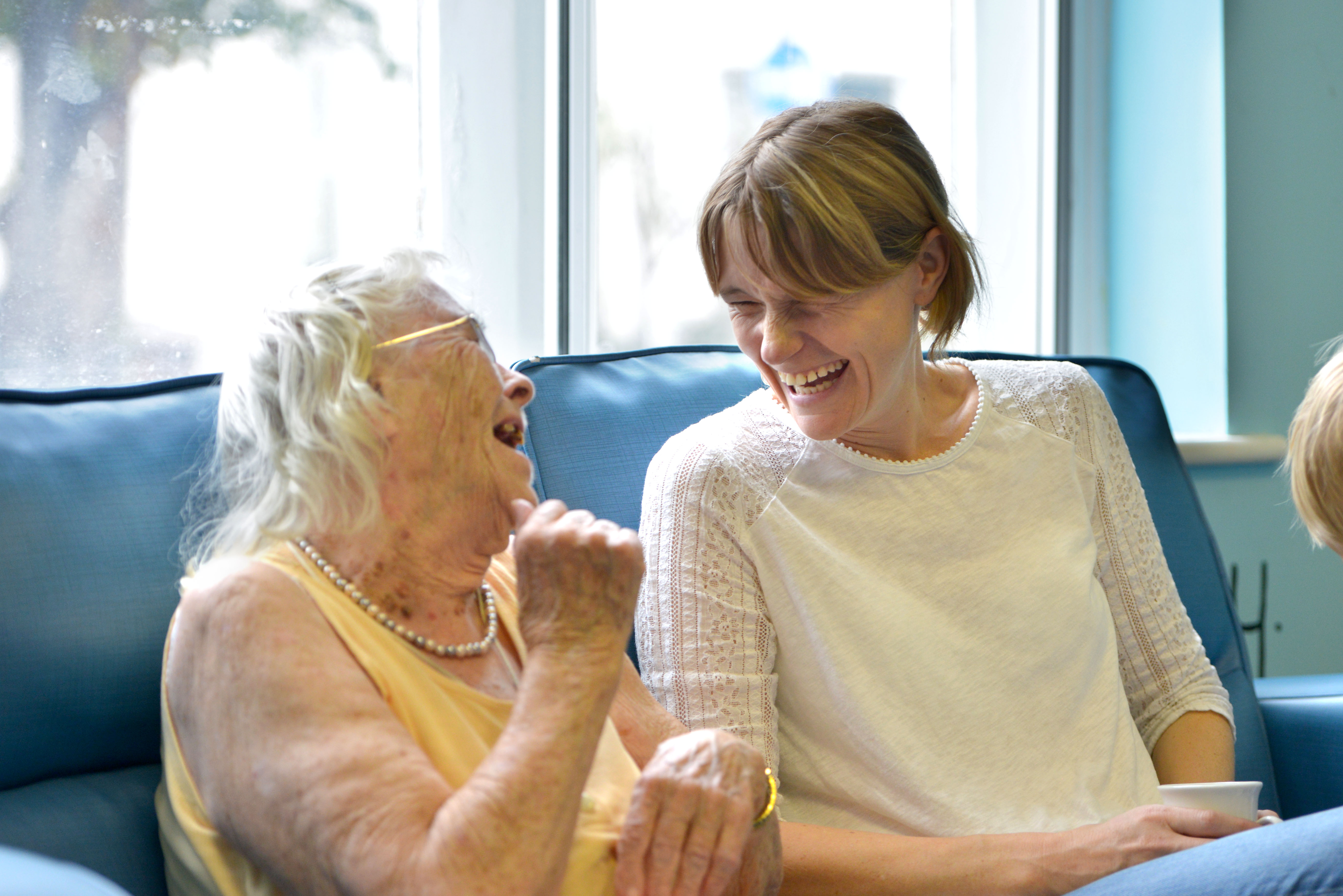 Two ladies talking and laughing