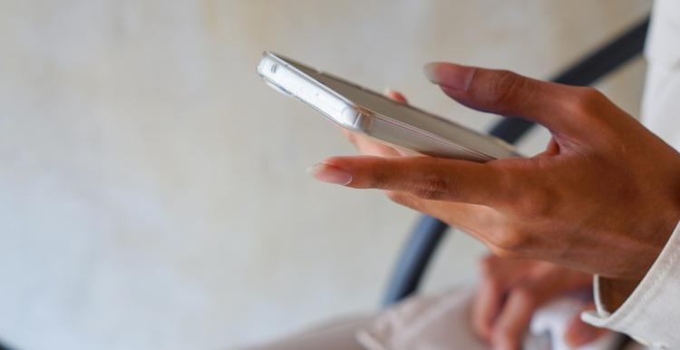 Holding a mobile phone in hand