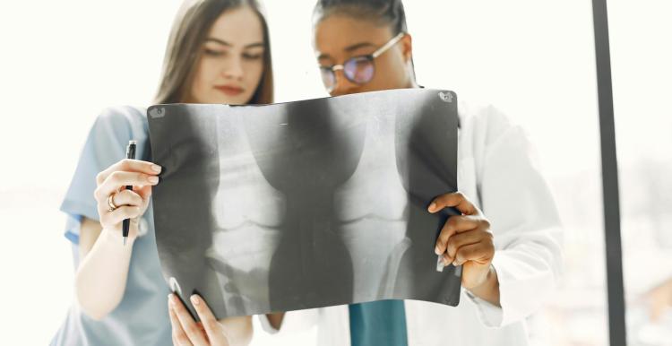 Doctor and nurse examining an x-ray