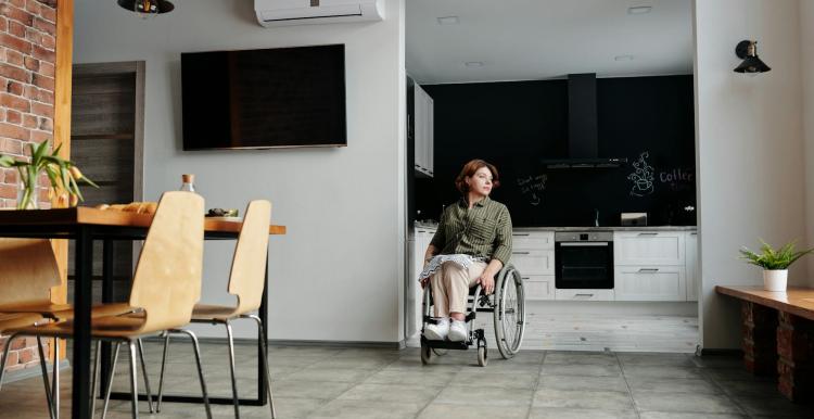 Woman Sitting on Wheelchair While Looking Away