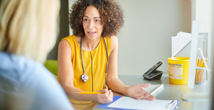 A lady talking to her GP
