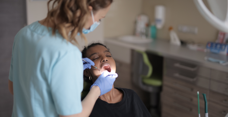 A patient in a dentist chair having treatment