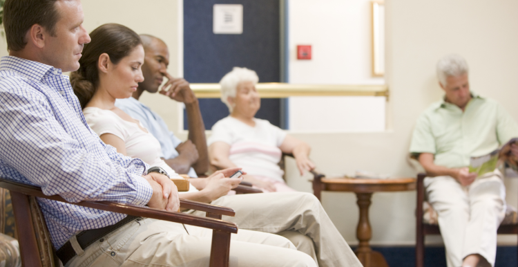 People sitting in a doctors waiting room