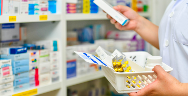 A pharmacist gathering medication