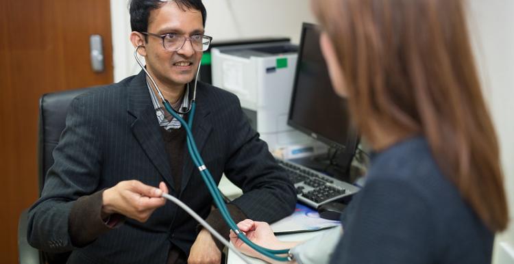 GP staff member with patient