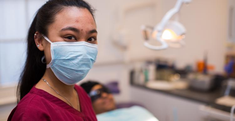 Dentist with patient in chair