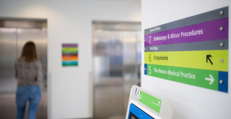 Close up of a direction sign at a hospital