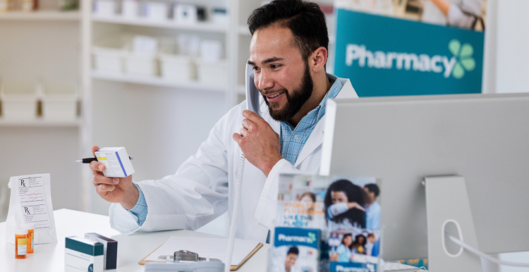 Pharmacist on phone with prescriptions