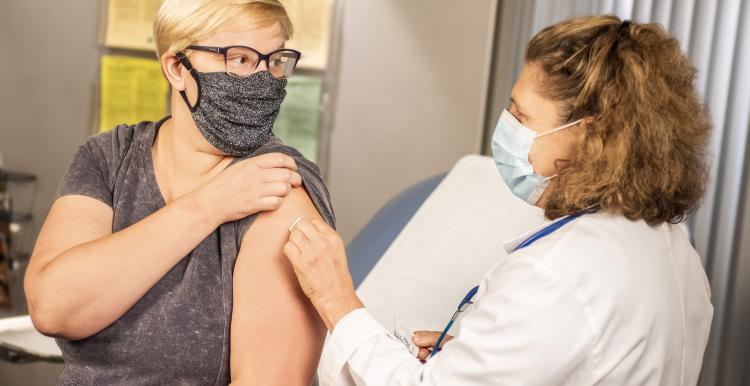 Woman getting her vaccination 