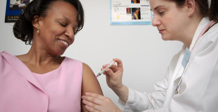 Lady getting a flu vaccination 