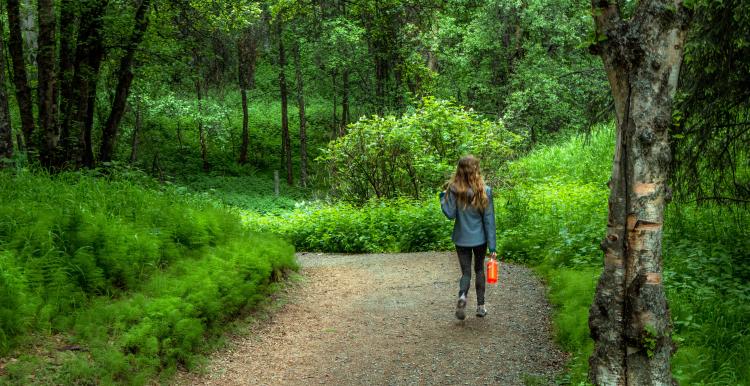 Girl walking in the woods