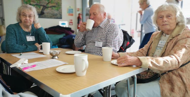 Three people at a memory cafe