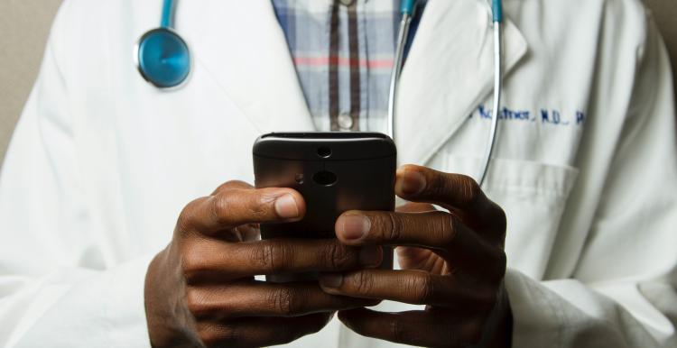 Doctor with mobile phone in their hand