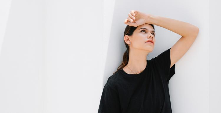 Woman hiding from the sun