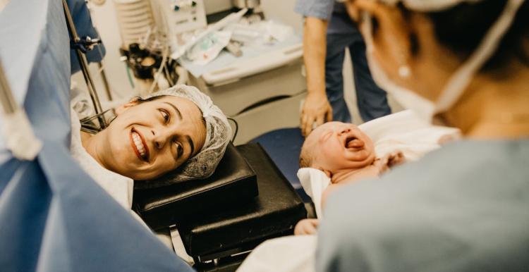 Baby being born via c-section in a hospital