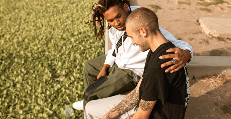 Two adult males chatting