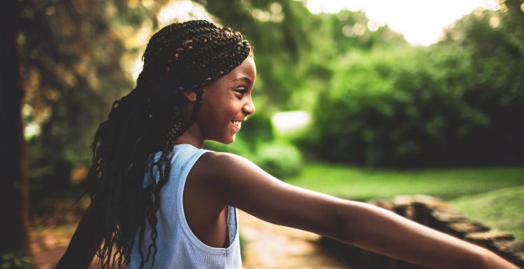 Girl smiling in the woods