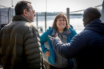 3 adults chatting with each other