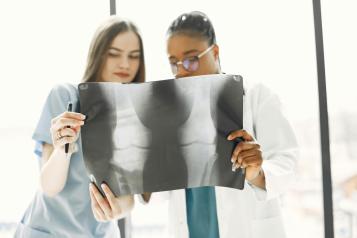Doctor and nurse examining an x-ray
