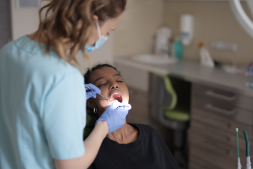 A patient in a dentist chair having treatment