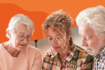 Two elder parents talking to their daughter with orange background