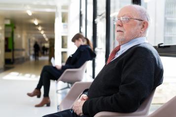 Man sitting in chair waiting for appointment