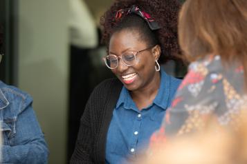 Two ladies talking at an event
