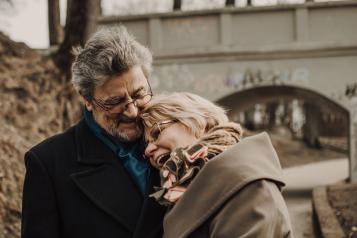 couple holding hands and laughing