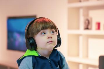 Young boy listening to music