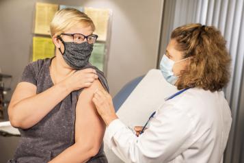 Woman getting her vaccination 