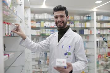 A pharmacist smiling 