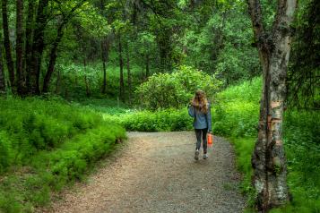 Girl walking in the woods