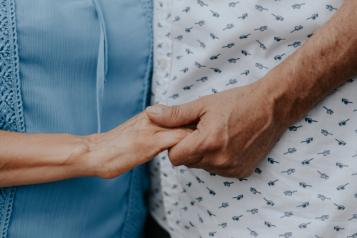 older couple holding hands