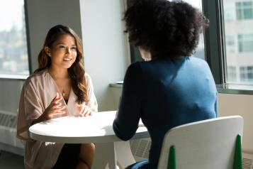 A lady talking to a social prescriber about her medical condition 