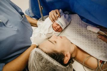 Mother and baby in delivery room
