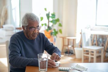 Man sitting at a table at home