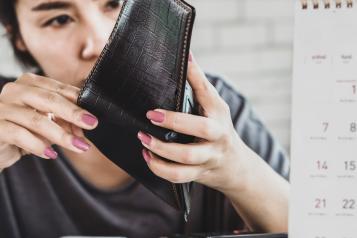 Lady looking into her wallet