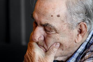 An older man looking down