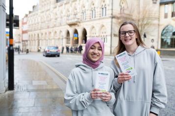 Two young people volunteering with Healthwatch.