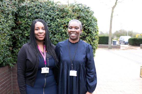 Two ladies from Healthwatch smiling at the camera