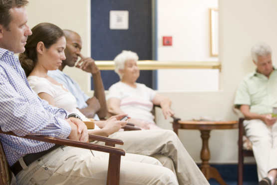People sitting in a doctors waiting room