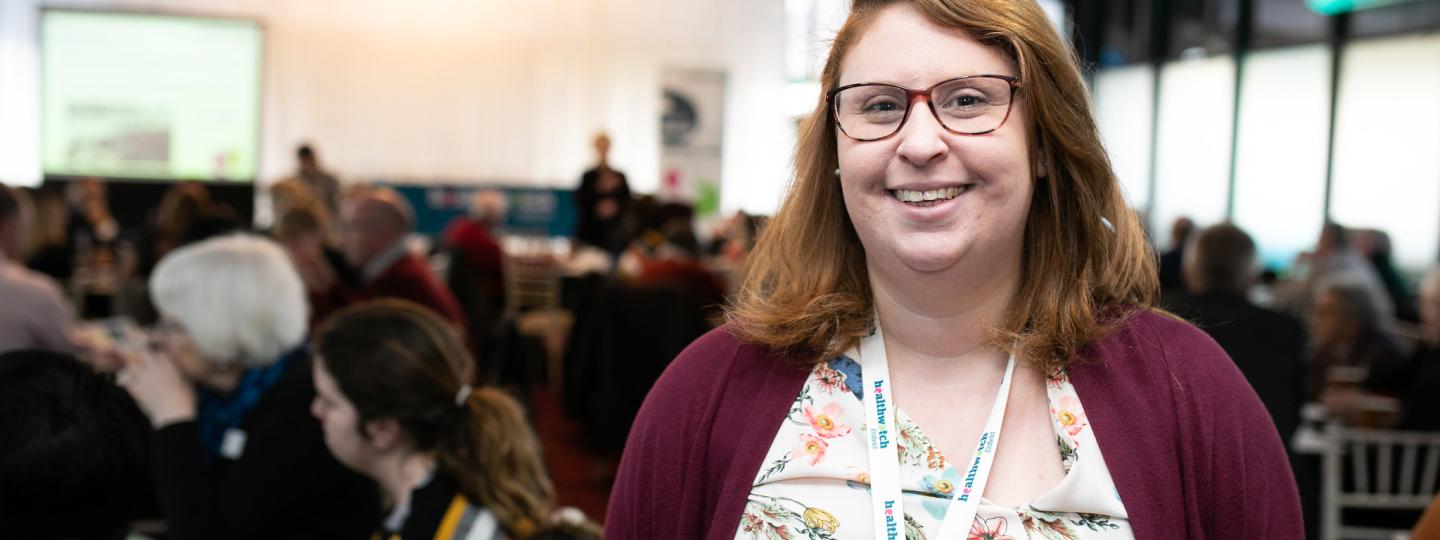 Healthwatch lady standing in a conference