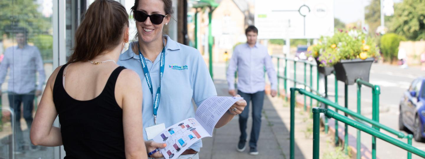 Healthwatch volunteer chatting with a lady