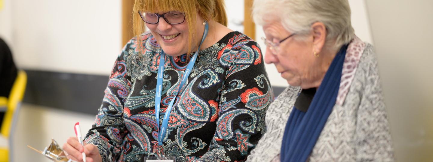 Healthwatch volunteer chatting with a lady
