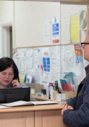 Man standing at GP reception
